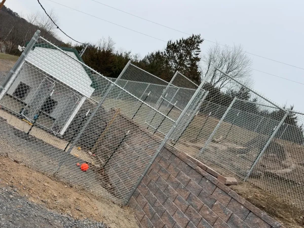 Chain-link enclosure with walk and drive gates