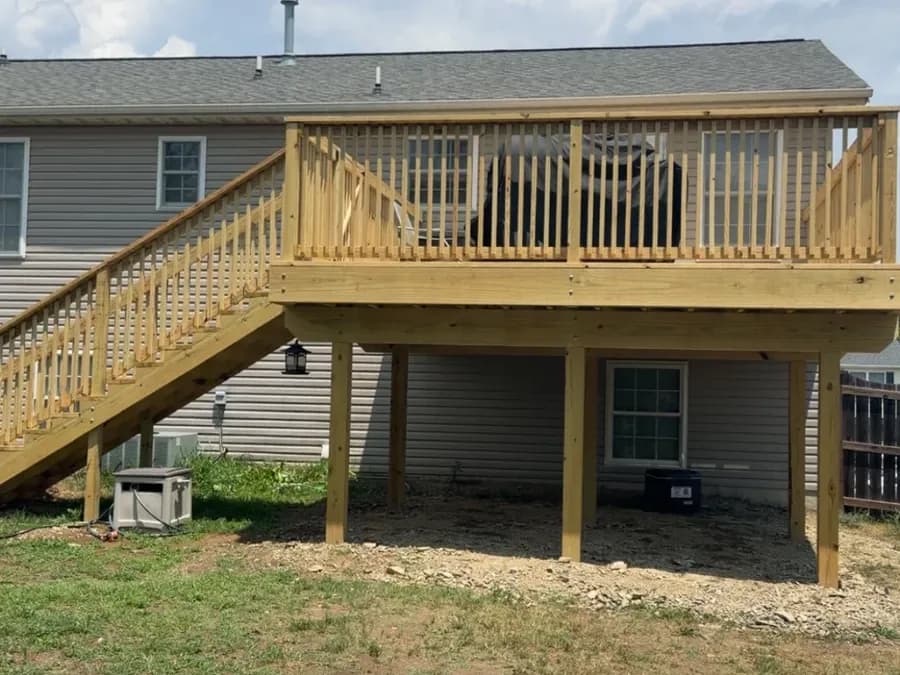 Elevated pressure-treated deck showing full post-and-beam structure