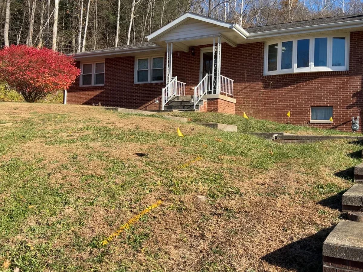 White aluminum porch railings on a brick ranch home