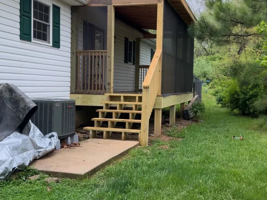 Screened porch addition framed and screened on a single-story home