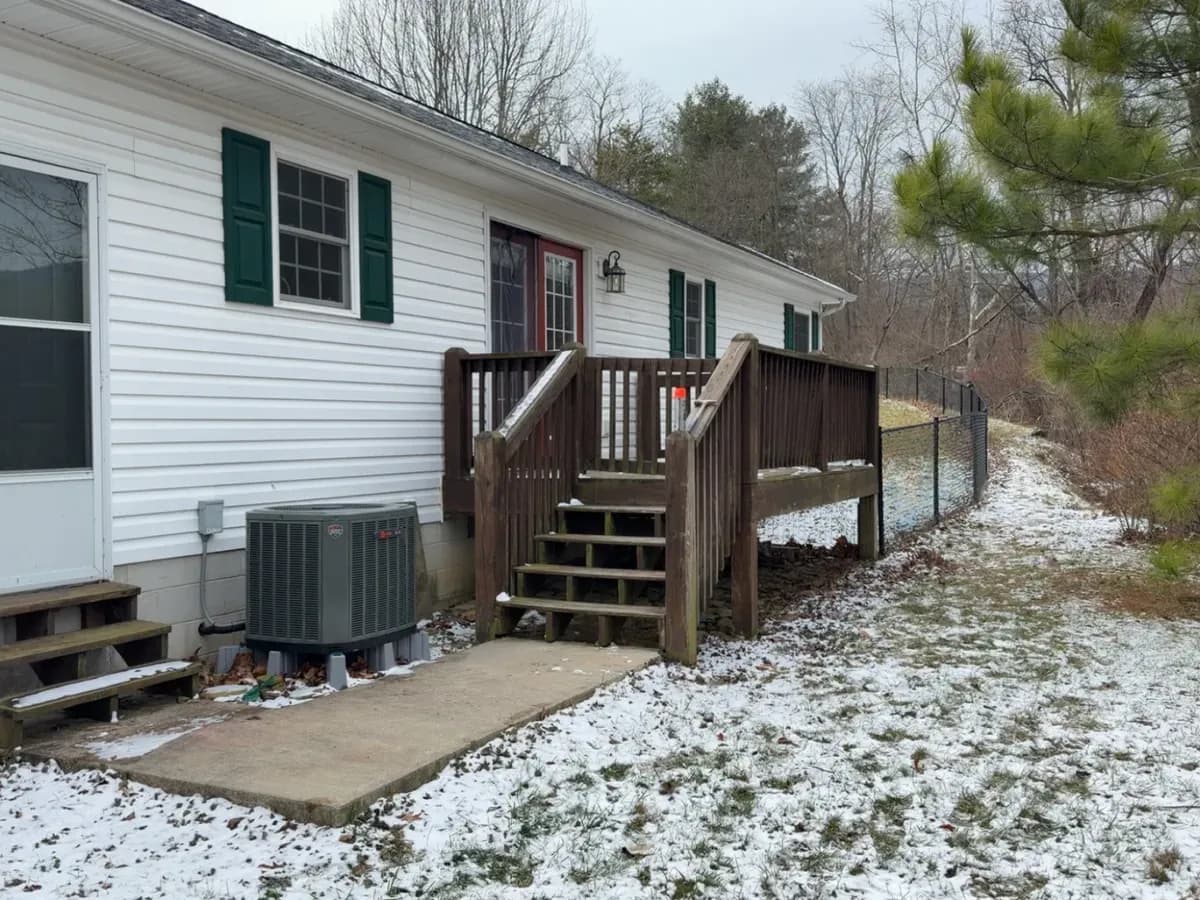 Weathered gray deck boards before cleaning and staining